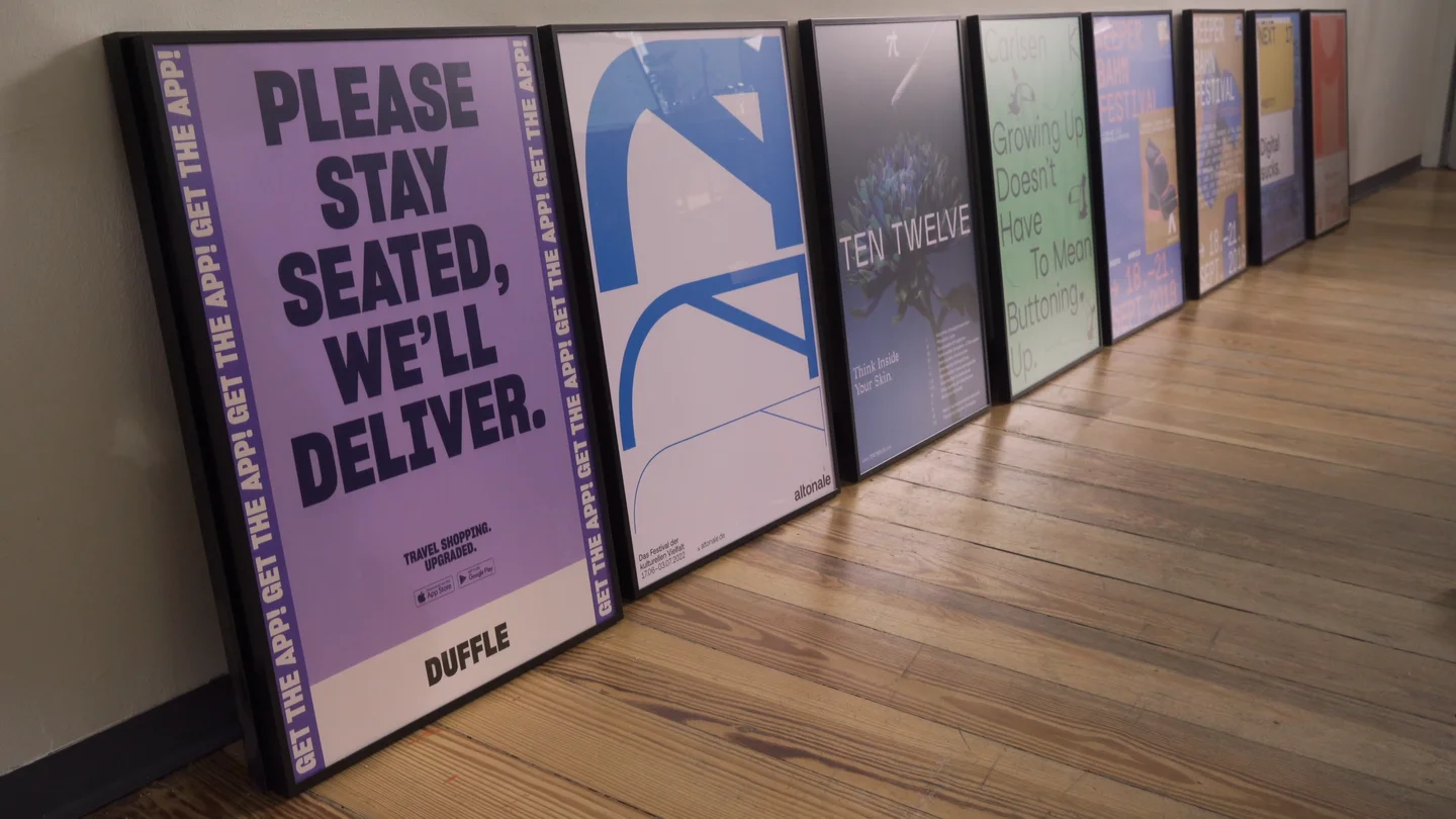 Colorful Duffle campaign posters displayed in a studio